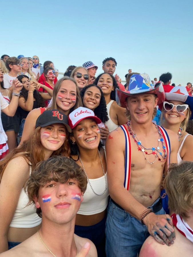Westerville South students Michael Murray, Hannah Pestorius, Lauryn Bowie, Thatcher Dietz, Carly Bithell, Alex Swank, Marissa Saunders, Neila Guice and Emily Hoelscher participating in the Red, White, and Blue theme of last weeks football game at Olentangy high school. Junior, Carly Bithell said “ I love our school spirit this year and seeing how much fun everyone has.The games are definitely a highlight of my week.”