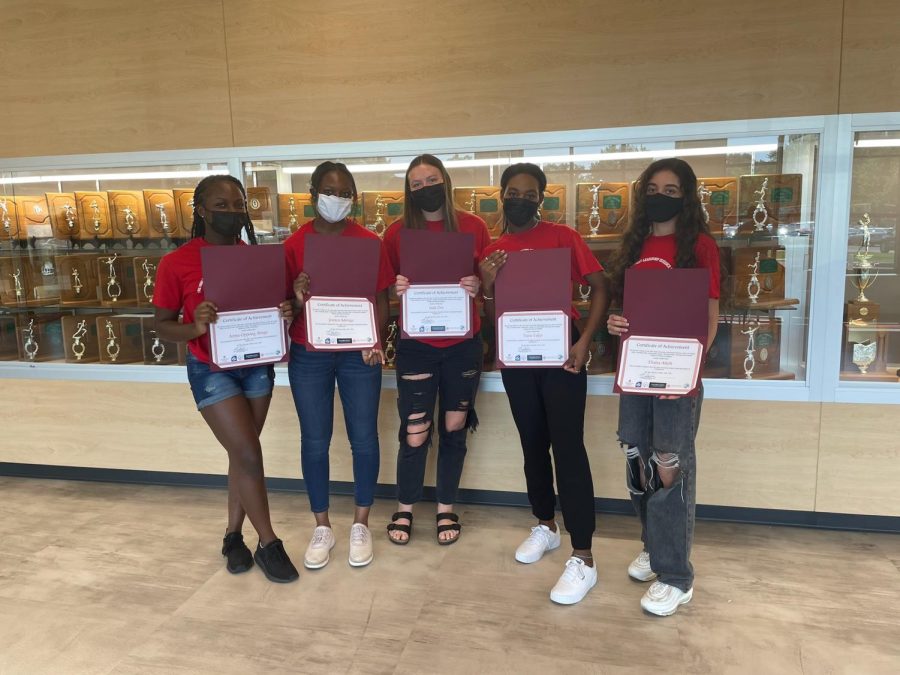Picture of Westerville South High School students Ama Oppong Brago, Jessica Adongo, Jada Orr, Tiara Takyi, and Diana Atieh (left to right) receiving certificates of achievements for their student-led “Intro to Adulting” project on Tuesday, Aug. 24, 2021. Diana Atieh says, “Students should take the opportunity to take this class because we do have the chance to offer it and it would be beneficial to them.”