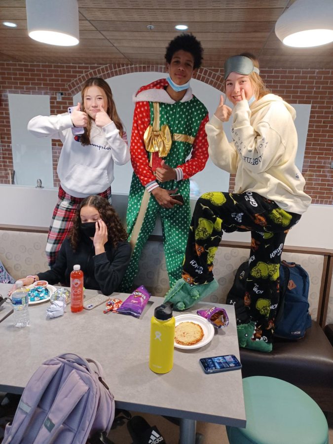 Left to right) Sophomore KiKi Moreland, Sophomore Jada Pride, Freshman Kruz McClure, and Sophomore Emily Hoelscher sporting their Christmas themed pajamas. Regarding the caring and sharing spirit week, the quartet said that they “are extremely excited to be a part of this.”