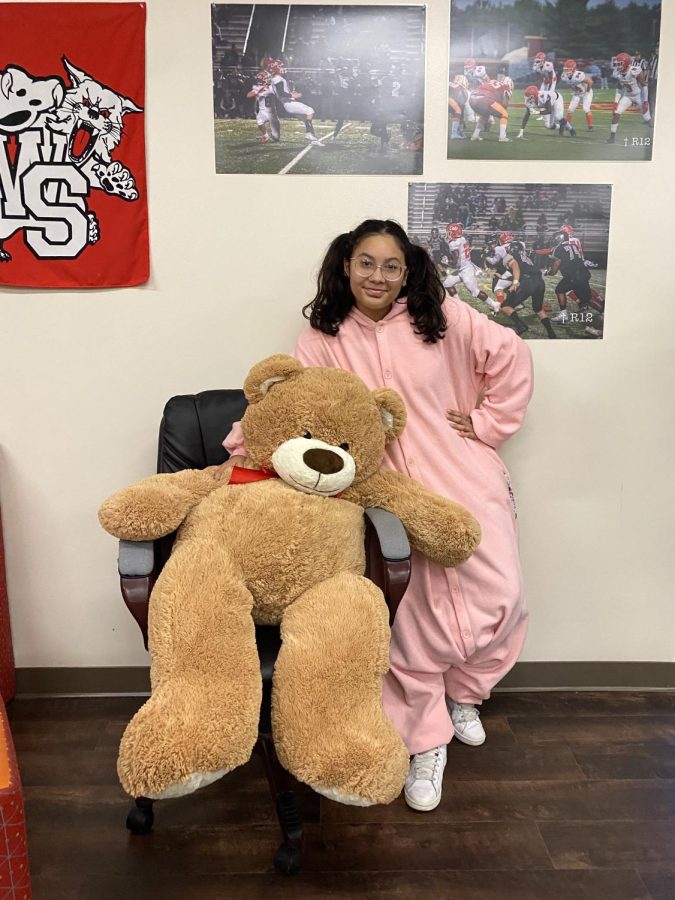 Senior Katherin Galvis brings a giant teddy bear and dress like a baby for the fourth day of spirit week.
