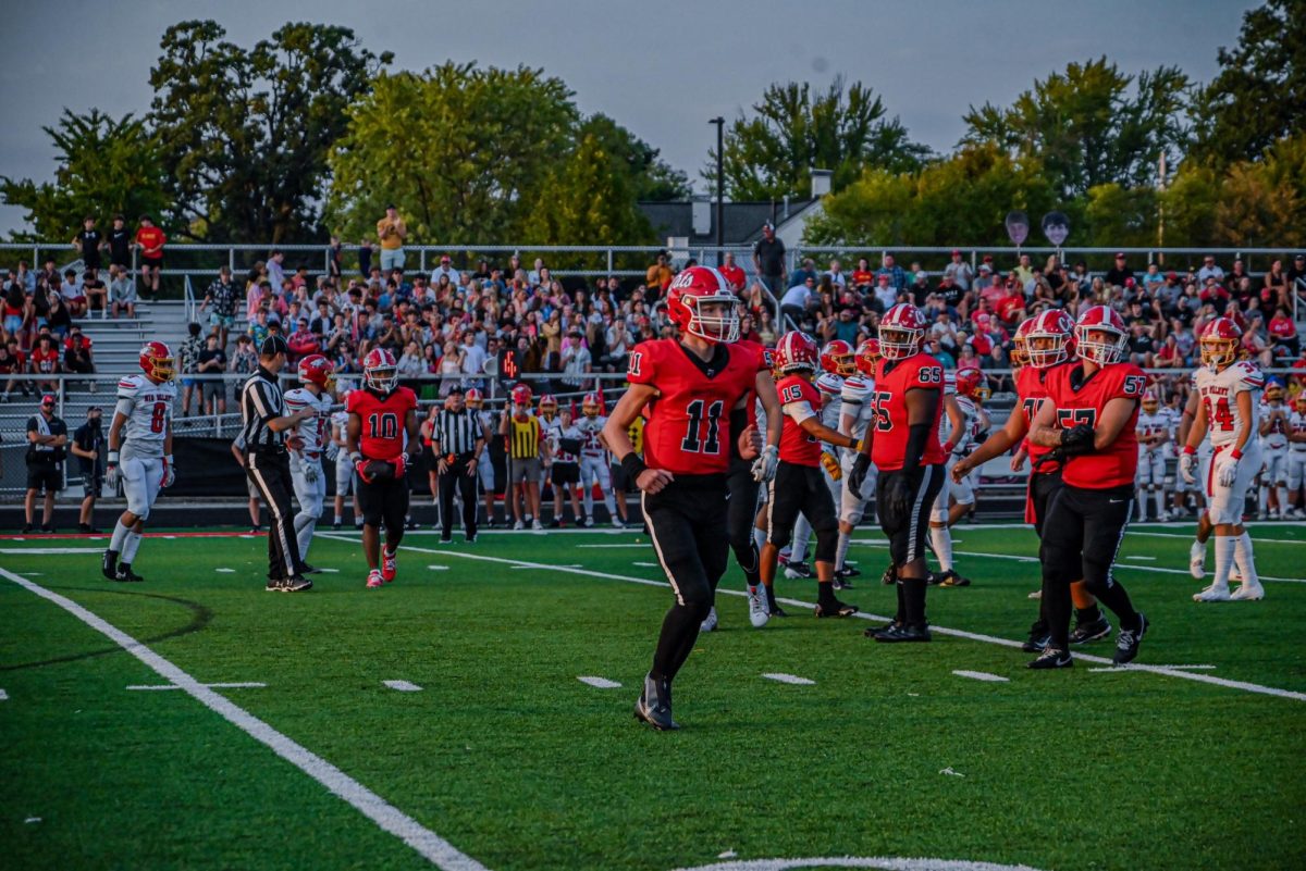 WSHS Football Player gets Prepared for Next Play During Big Walnut Game