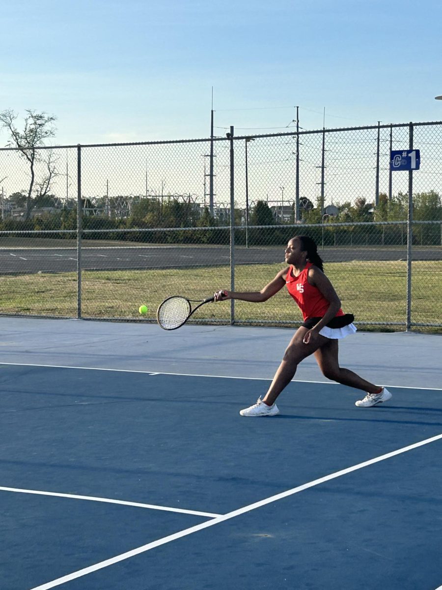 Sophomore Zariah Parish warming up before her match against opponents  Central Crossing on Sept.13