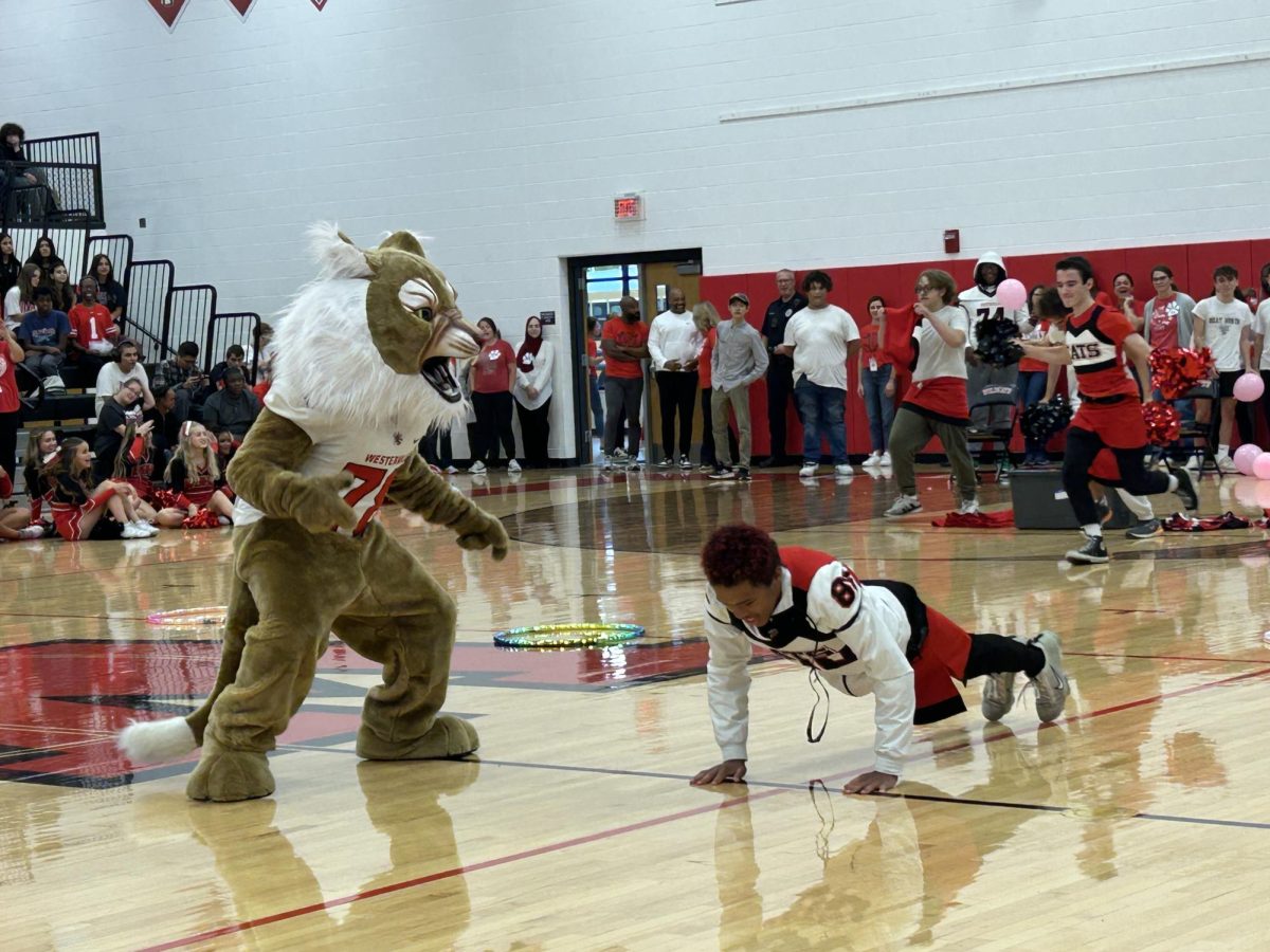 Zach Johnson Rises to the Challenge with Push-Ups as Wesley the Wildcat Cheers Him on at Souths Pep Rally