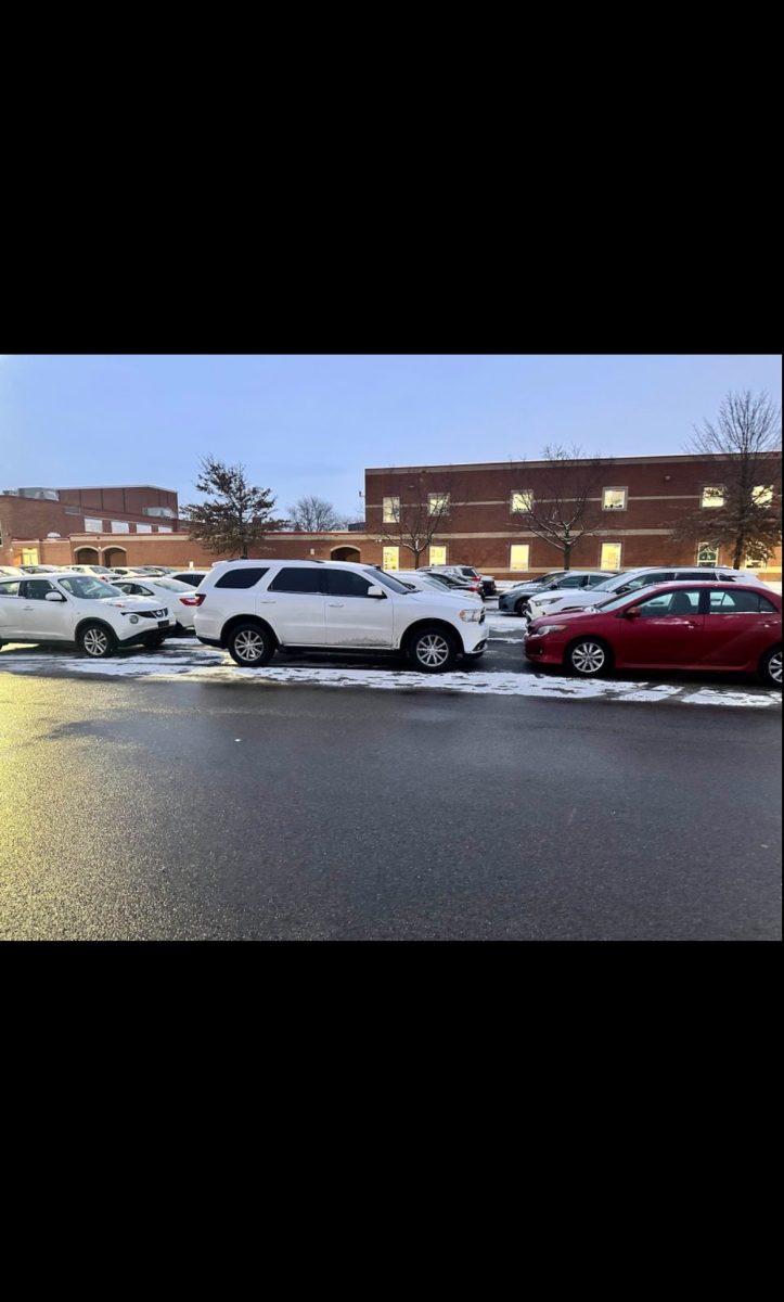 Westerville South Senior parking lot on January 16th in the morning before school. The parking lots were snowy and students couldn't see the lines, so they created their own row. "I was trapped in the middle and was worried I would not be able to get out without hitting someone," said Senior Anna Miller.