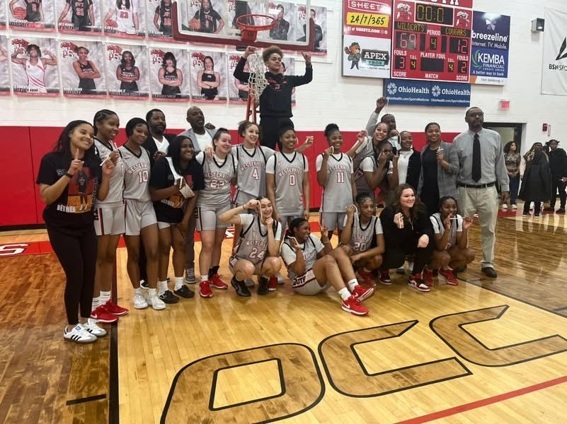 Girls basketball varsity team celebrates their OCC title win over Westland defeating them 69-12 on Feb.2.