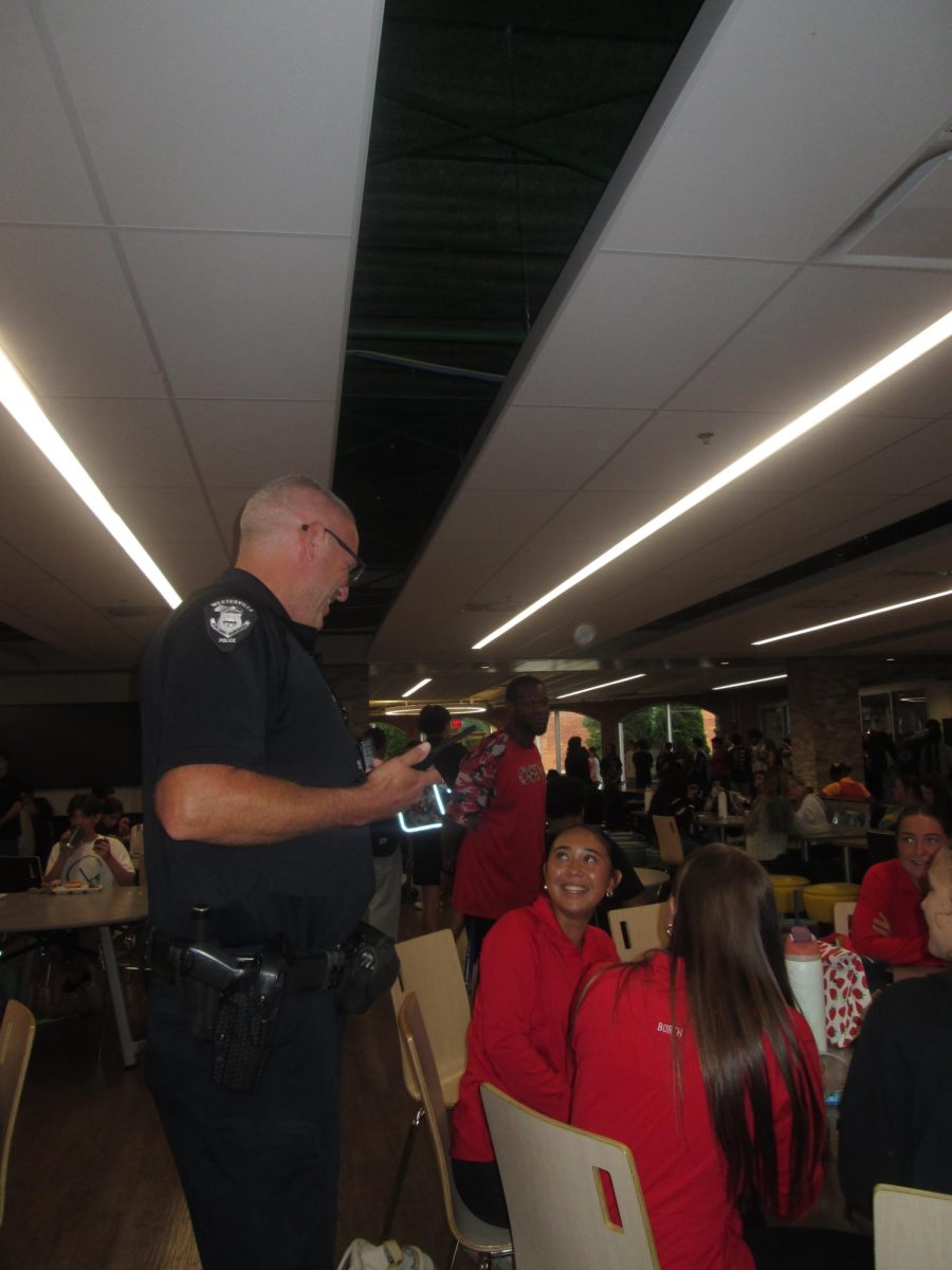 Thursday afternoon and conversations are buzzing in the cafeteria during 6th period lunch, where Westerville South school resource officer Keith Jackson converses with two varsity soccer players: senior Adeline Quisumbing and junior Madilyn Borth.
