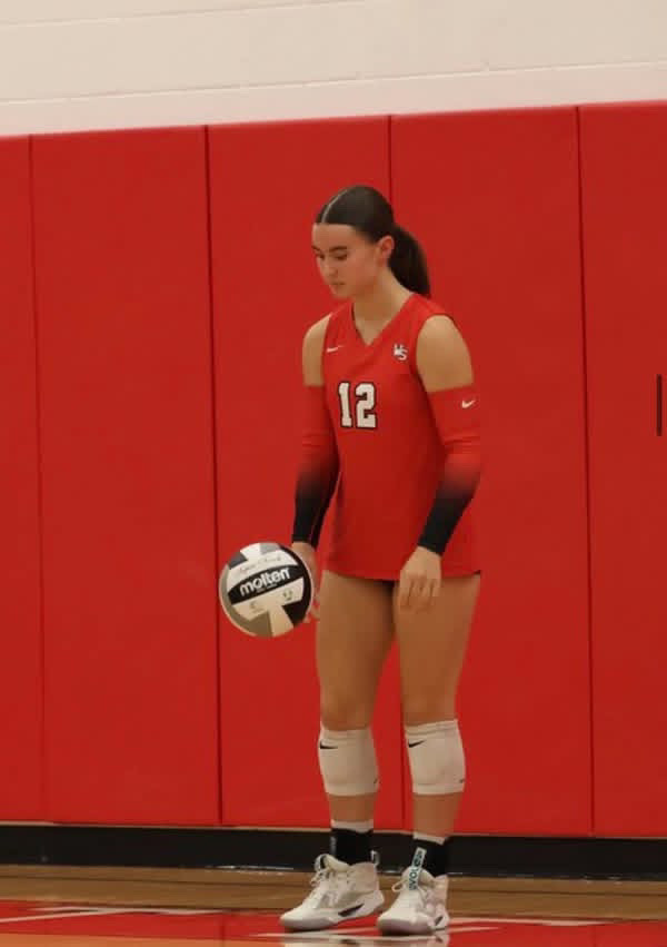 MacClements preparing to serve v.s. Watkins Memorial