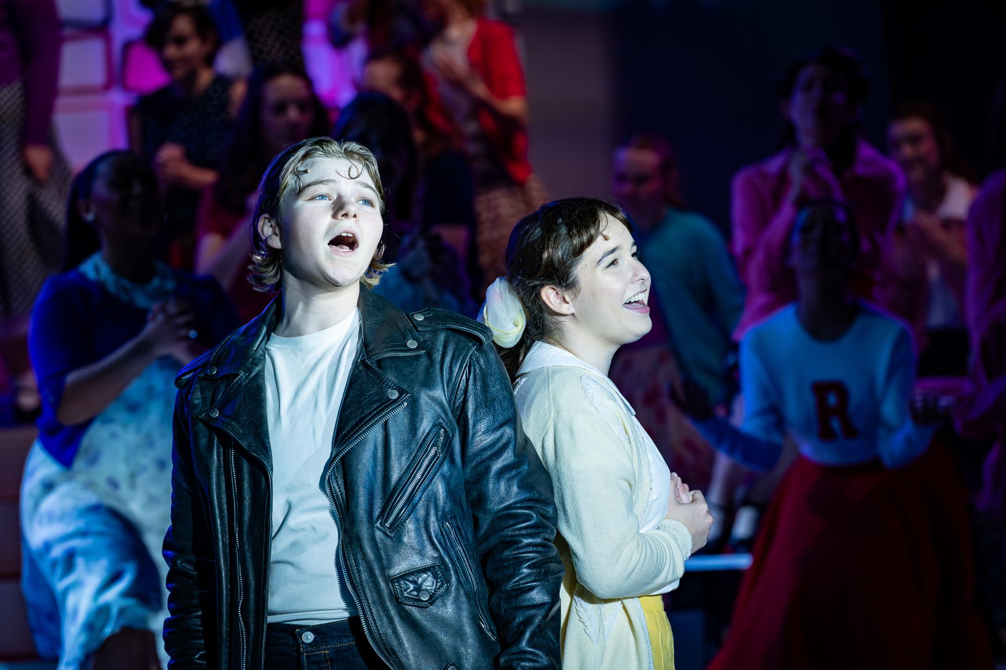 Seniors Asher Light (left) and Addie Gurgiolo (right) playing as Danny Zuko and Sandy Dumbrowski during the final show of the 25-26 school year Grease.